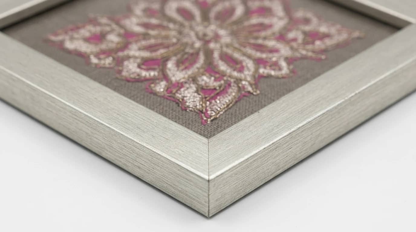 Zardozi in close view — fuchsia and silver thread, sequin by sequin.